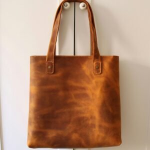 Editorial leather tote image; illustrative category photo